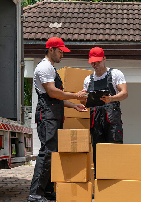 Smith & Sons Moving movers loading boxes outside a home in local service areas