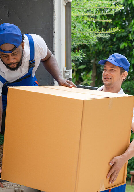 Smith & Sons Moving unloading a box from a truck for clients in Southfield, MI